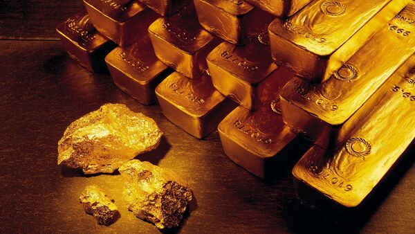 In this undated handout photo released by Newmont Mining Corporation, gold nuggets and bars are shown.